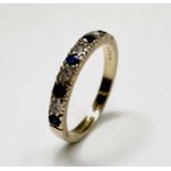 An 18ct gold ring hoop set with sapphires alternating with bright diamonds 3gm Size N/O Hallmarked