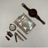 A pearl veneered card case, a silver fob watch with leather strap, a fruit knife an agate seal, a