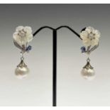A pair of white mother of pearl and South Sea pearl earrings with tanzanite in 925 platinum coated