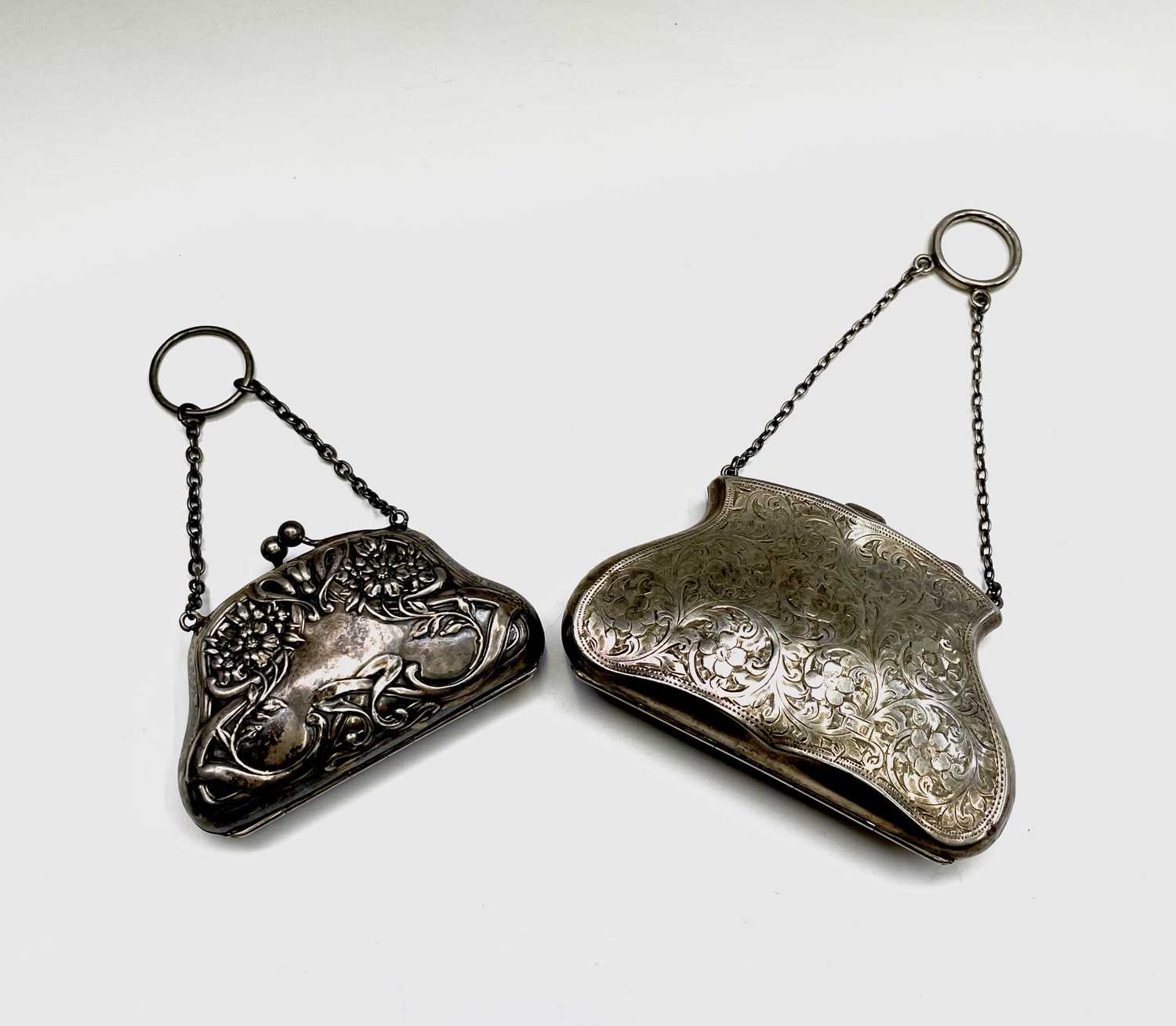 An Edwardian silver Art Nouveau purse Birmingham 1907 and an engraved silver purse Birmingham 1912