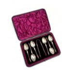 A set of six silver Apostle coffee spoons and matching tongs, cased