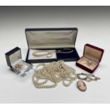 A cultured pearl necklace with 9ct gold clasp, a 9ct gold cased ladies wristwatch, earrings