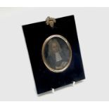 An early 18th-century portrait on copper of a cleric holding a book 7.5x6.5cmCondition report: Not