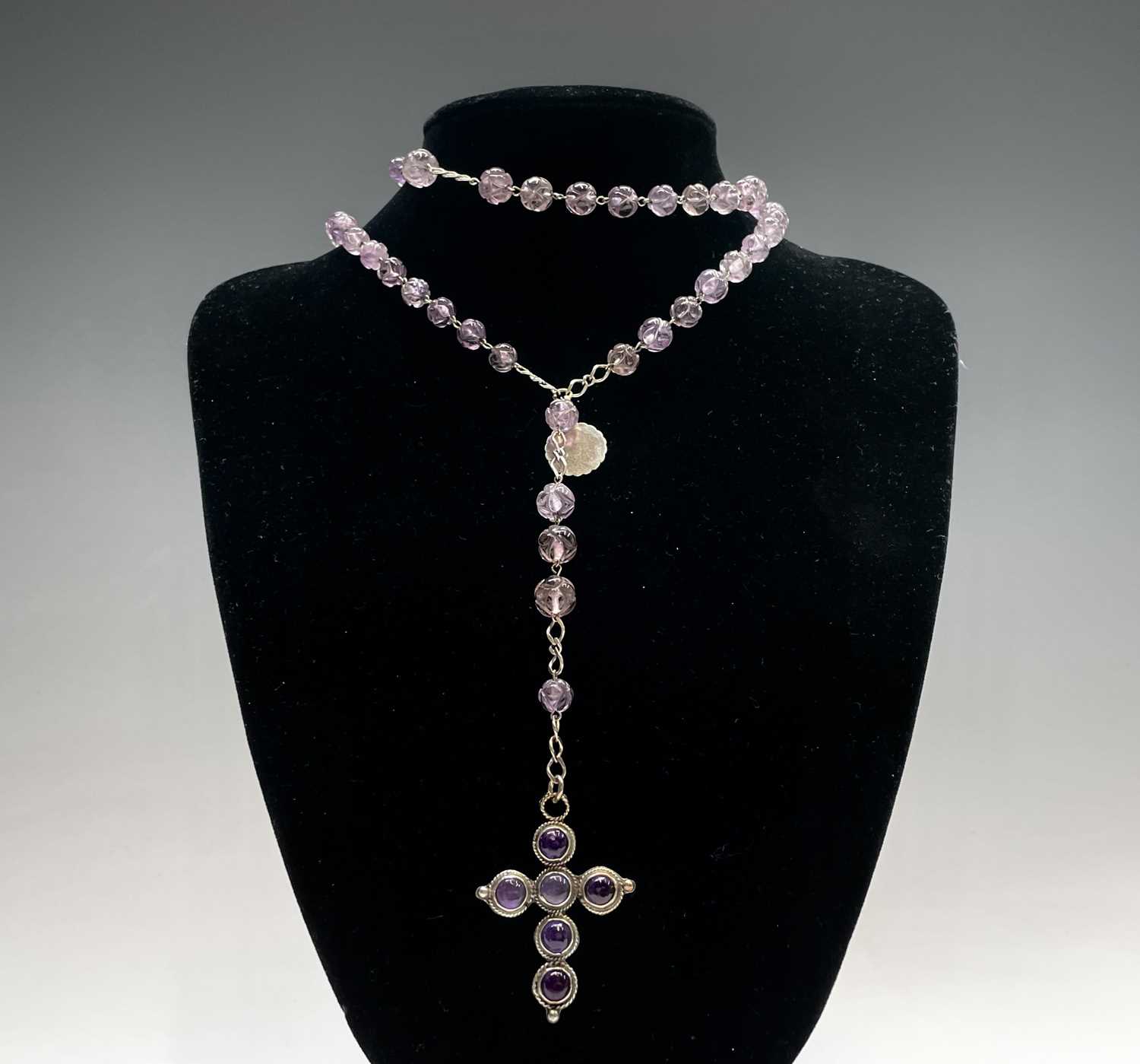 A rosary with carved amethyst beads and amethyst set silver cross, two chased silver crosses each - Image 2 of 8