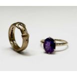 A 9ct gold buckle ring 4.9gm Size O together with a 9ct gold amethyst set ring Size T 2.3gm