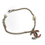 Chanel braceletGoldtone chain with two faux pearls and suspended CC logo pendant enamelled in