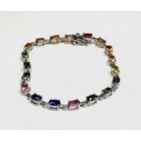 Multi coloured sapphire bracelet set with blue, green, yellow, orange and pink sapphires in platinum