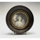 An 18th-century portrait of a lady reclining on pillows she wears a décolleté dress 6.5cm diameter