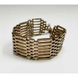 A 9ct gold seven-bar gate-link bracelet 20cm 28.2gm