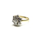 A wonderful bright seven diamond cluster ring totalling approximately 1.2cts set in 18ct gold London