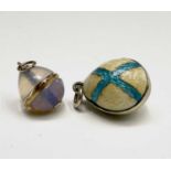 A gold-mounted miniature opal and crystal egg 12mm excluding mount and an enamelled miniature egg