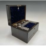A Victorian rosewood veneered toilet case, the cut glass jars with silver plated lids 32cm wide.