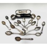 Silver spoons a silver pusher and two plain silver napkin rings 10.7oz