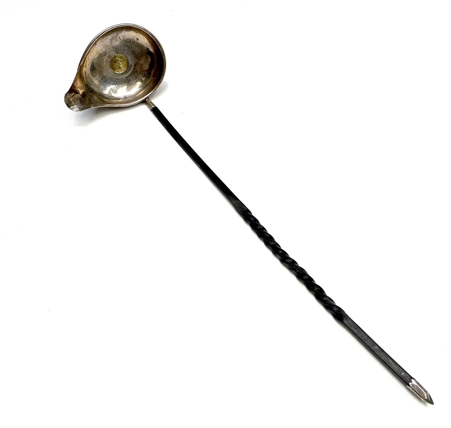 A George III punch ladle set with a 1808 gold third of a guinea, with spiral whale bone handle.