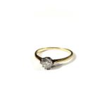 An 18ct gold ring set with a solitaire diamond of just over 0.5ct