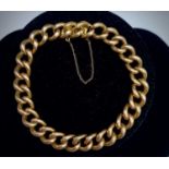 A 15ct gold curb link bracelet 22.2gmCondition report: The clasp and safety chain are working and