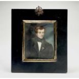 Portrait miniatureAn early 19th century portrait of a handsome young gentleman in black frock coat