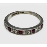 A platinum ring hoop set with 5 rubies and 4 diamonds 3.2gm Size L