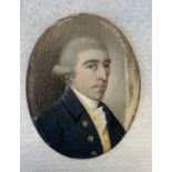 Portrait miniature19th century portrait on ivory of a bewigged gentleman in a blue frock coat.