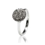 A delightfully bright diamond set 18ct white gold target cluster ring 4.7gm, Size T