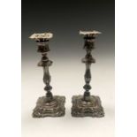 A pair of Elkington epns candlesticks in George II style with detachable drip pans 25.2cm