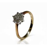 A 9ct gold ring set a diamond daisy cluster totalling 0.33ct Size P