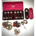 Murano beads, African slave trade beads, a silver spoon cased, epns spoons etc.Condition report:
