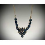 A 14ct gold necklace set with sapphires and diamonds 6.5gmCondition report: This is 43cm long and in