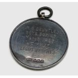 An H.M.S. Dauntless silver Boys Boxing medal 1922 by Fattorini, 32.4mm 13.6gm. Boxed