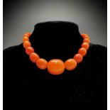 An amber necklace the largest bead 25.6mm 32.9gmCondition report: This is natural amber