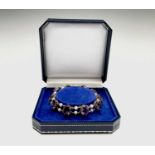A pretty 9ct gold amethyst and pearl bracelet by Ewing Edinburgh 15.8gm Hallmark indistinct but