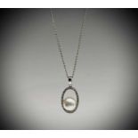 An 18ct white gold 6.97mm pearl pendant with a halo of diamonds on 18ct white gold chain 3.6gm