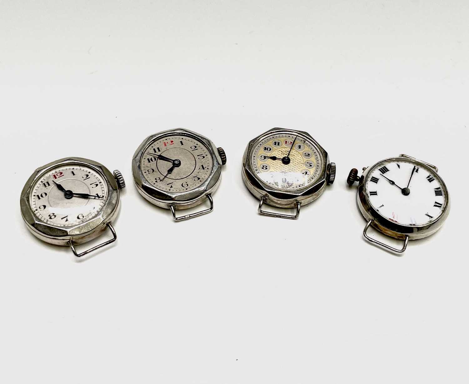 Four ladies silver cased trench style watches.Condition report: All working, used condition