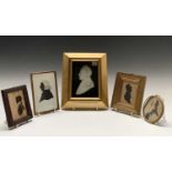 Three early 19th century miniature silhouettes and a larger plaster profile. A be-wigged