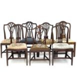 A pair of George III mahogany Hepplewhite style dining chairs with floral embroidered drop-in seats,