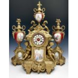 A 19th century gilt metal and porcelain three piece clock garniture, height of clock 56cm, width