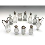 A collection of Georgian and later cruet bottles, some with silver mounts. Height 21cm