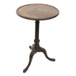 A George III mahogany circular wine table, with dished top and raised on a fluted pillar with leaf