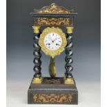 A mid 19th century French portico mantel clock, contained in an ebonised and boxwood inlaid case,
