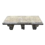 A classical design composition stone garden bench raised on three supports. Height 41.5cm, width