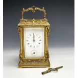 A late 19th century gilt metal carriage clock, stamped 'Aiguilles Reveil, 5011, Moser A. Paris',