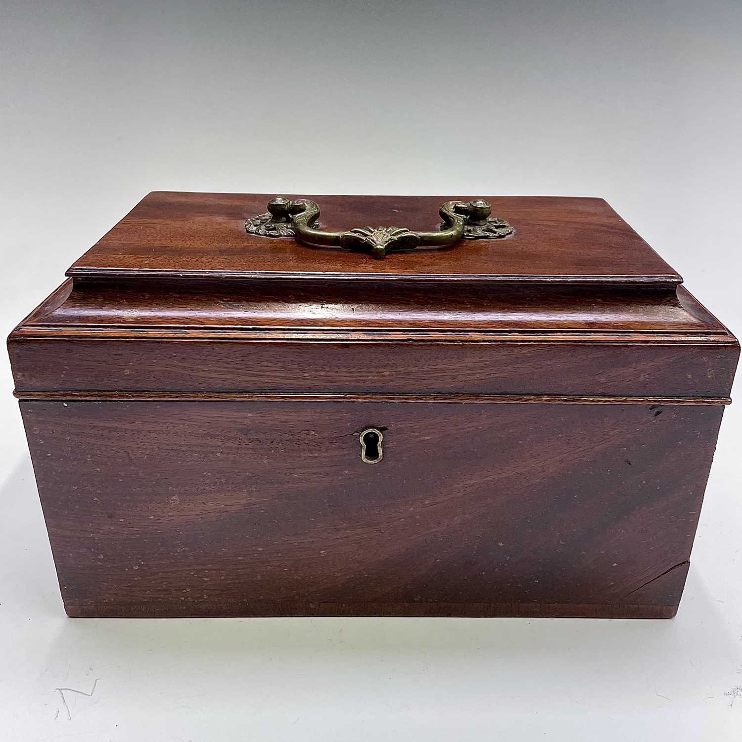 A mid George III mahogany and chequer strung caddy with triple divided interior. Width 25cm.