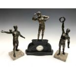 An Art Deco period spelter and marble three piece figural clock garniture, the figures modelled as