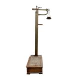 A set of late 19th century Avery platform scales in oak and brass, complete with a set of nesting