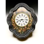 A late 19th century French ebonised wall clock, the white enamel dial indistinctly signed and