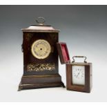 A 19th century mahogany brass inlaid mantel clock and a brass carriage clock, in original leather