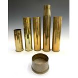 Six assorted WWI and WWII brass shell cases, the tallest 45cm high.