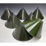 A set of seven green enamel on metal light shades, diameter 26cm.