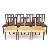 A set of four Regency mahogany dining chairs with carved vertical slats, on square taper legs,