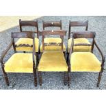 A group of six Regency and William IV mahogany dining chairs, raised on turned front legs,